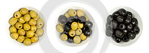Pitted green and black olives, Hojiblanca, in white bowls from above