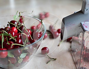 Pitting or coring cherries with a cherry pitter