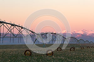 Pivot Irrigation System with Mountain Range in background