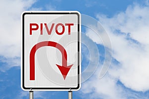 Pivot road sign with cloud sky