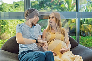 In a pivotal moment, the pregnant woman and father navigate the onset of contractions together, sharing the intensity