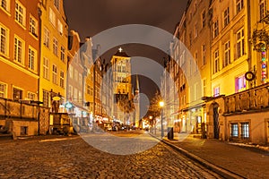 Piwna street and view on the St Mary`s Basilica Tower in Gdansk, Poland, evening, no people