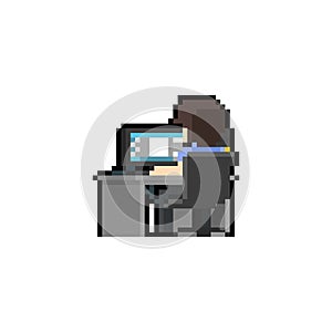 Pixel art man character working at computer desk.