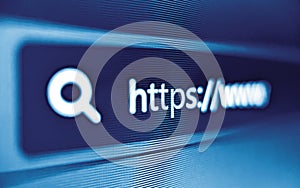 Pixelated closeup view of internet browser address bar with https and search icons in blue