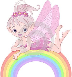 Pixie fairy on rainbow