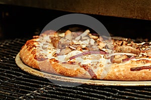 Pizza baking in the commercial oven