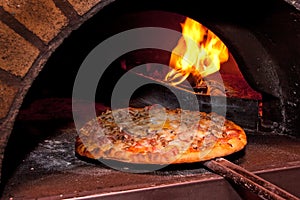 Pizza baking in the oven photo