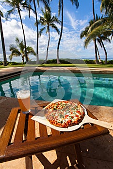 Pizza and beer by the poolside in Hawaii