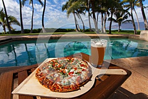 Pizza and beer by the poolside in Hawaii