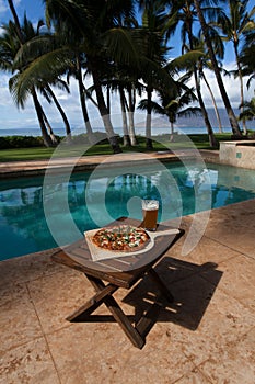 Pizza and beer by the poolside in Hawaii