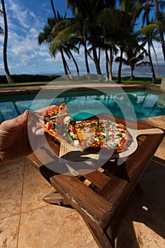 Pizza and beer by the poolside in Hawaii