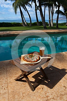 Pizza and beer by the poolside in Hawaii