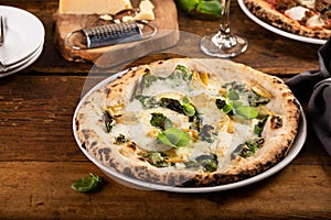 Pizza bianca or white pizza with artichokes and basil photo