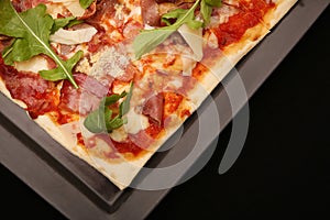 Pizza on the black background