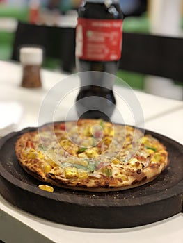 Pizza with bluer cock bottle