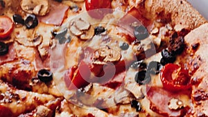 Pizza capriciosa in pizzeria, food close-up