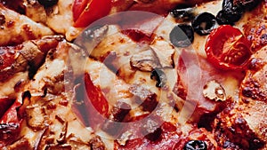 Pizza capriciosa in pizzeria, food close-up