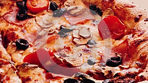 Pizza capriciosa in pizzeria, food close-up