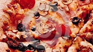 Pizza capriciosa in pizzeria, food close-up