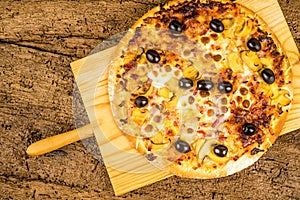 Pizza carbonara on kitchen table