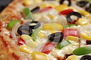 Pizza with cheese, blackolives,corn and bell pepper