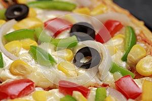 Pizza with cheese, blackolives,corn and bell pepper
