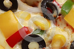 Pizza with cheese, blackolives,corn and bell pepper