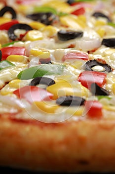 Pizza with cheese, blackolives,corn and bell pepper