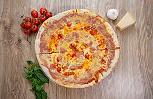 Pizza with cheese and cherry tomatoes top view with composition of 3 elements