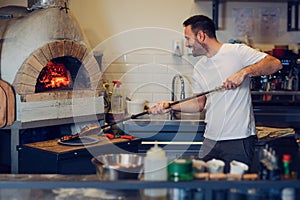 Pizza chef working in the kitchen