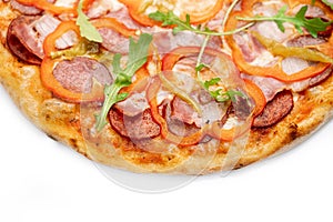 Pizza Close Up with sweet red and pickled pepper, ham, salami and cheese isolated on white background. Copyspace. Top