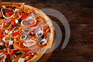 Pizza cut in slices, close up. Italian junk food.