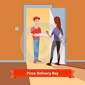 Pizza delivery boy handing pizza box to a girl