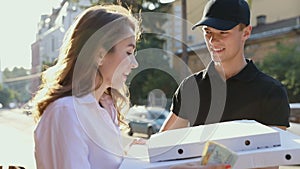 Pizza Delivery. Courier Delivering Box With Food To Client