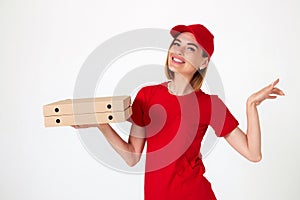 pizza delivery woman in uniform holding pizza boxes