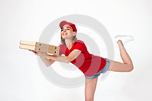 pizza delivery woman in uniform holding pizza boxes