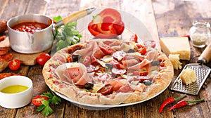 pizza dough with tomato sauce, ham