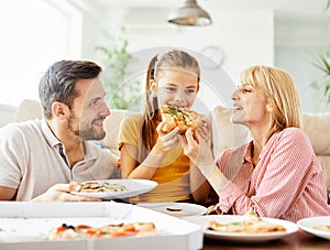 pizza family child food home eating daughter mother father happy meal together lunch dinner man woman girl fun