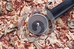 Pizza food texture background with pizza cutter