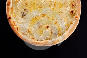Pizza four cheeses on a black background
