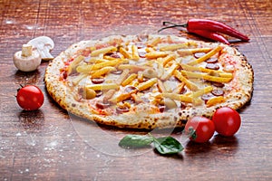 Pizza with french fries and sausage. Appetizing pizza with cheese and potatoes photo