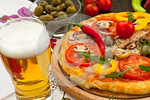 Pizza with glass of beer