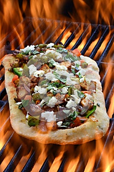 Pizza On A Grill With Flames