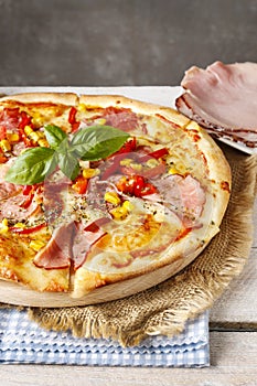 Pizza with ham, corn and pepper