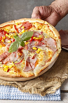 Pizza with ham, corn and pepper