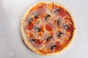 Pizza ham mushrooms pepperoni close-up top view isolated