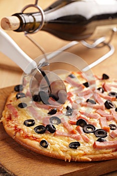 Pizza with ham and olives