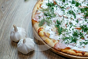 Pizza ham and sour cream white sauce cheese and dill detail