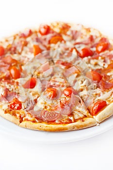 Pizza with ham and tomato