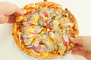 Pizza in hand in white background